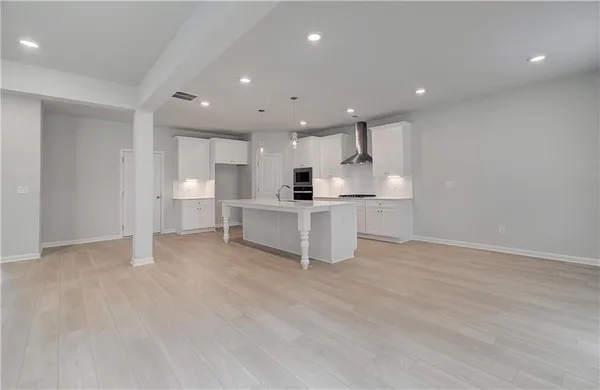 a view of kitchen with wooden floor