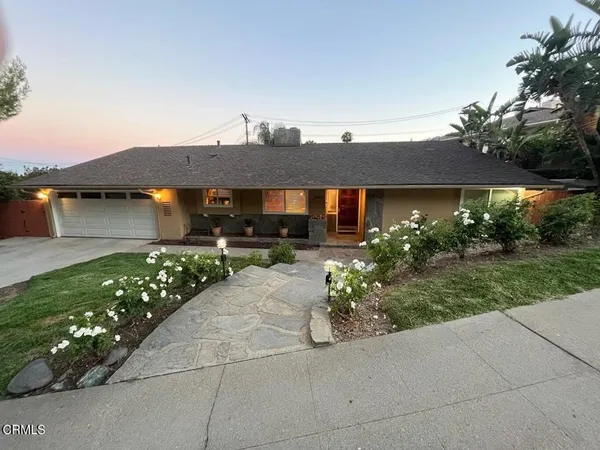 a view of a car park in front of house