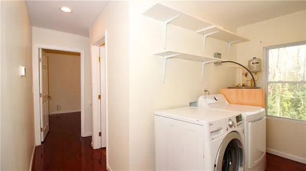 a utility room with dryer and washer