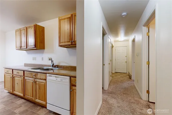 a kitchen with stainless steel appliances granite countertop a stove and a sink