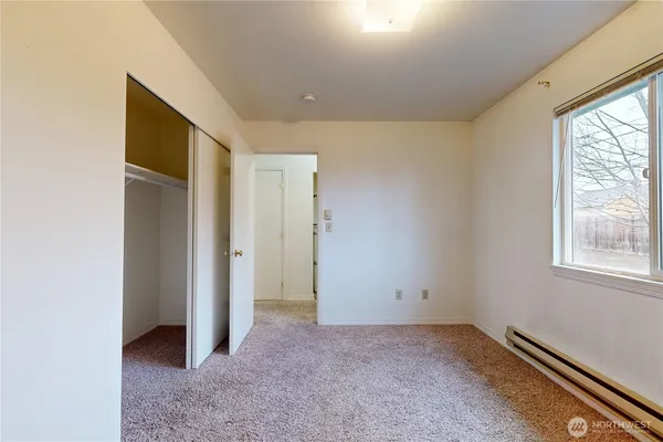 a view of an empty room with a window