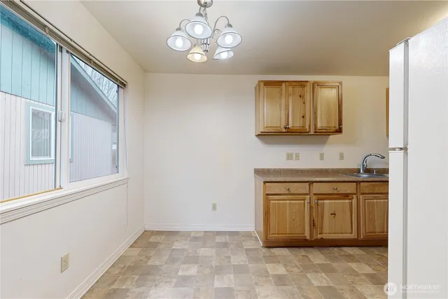a view of a kitchen with a sink cabinets and a window