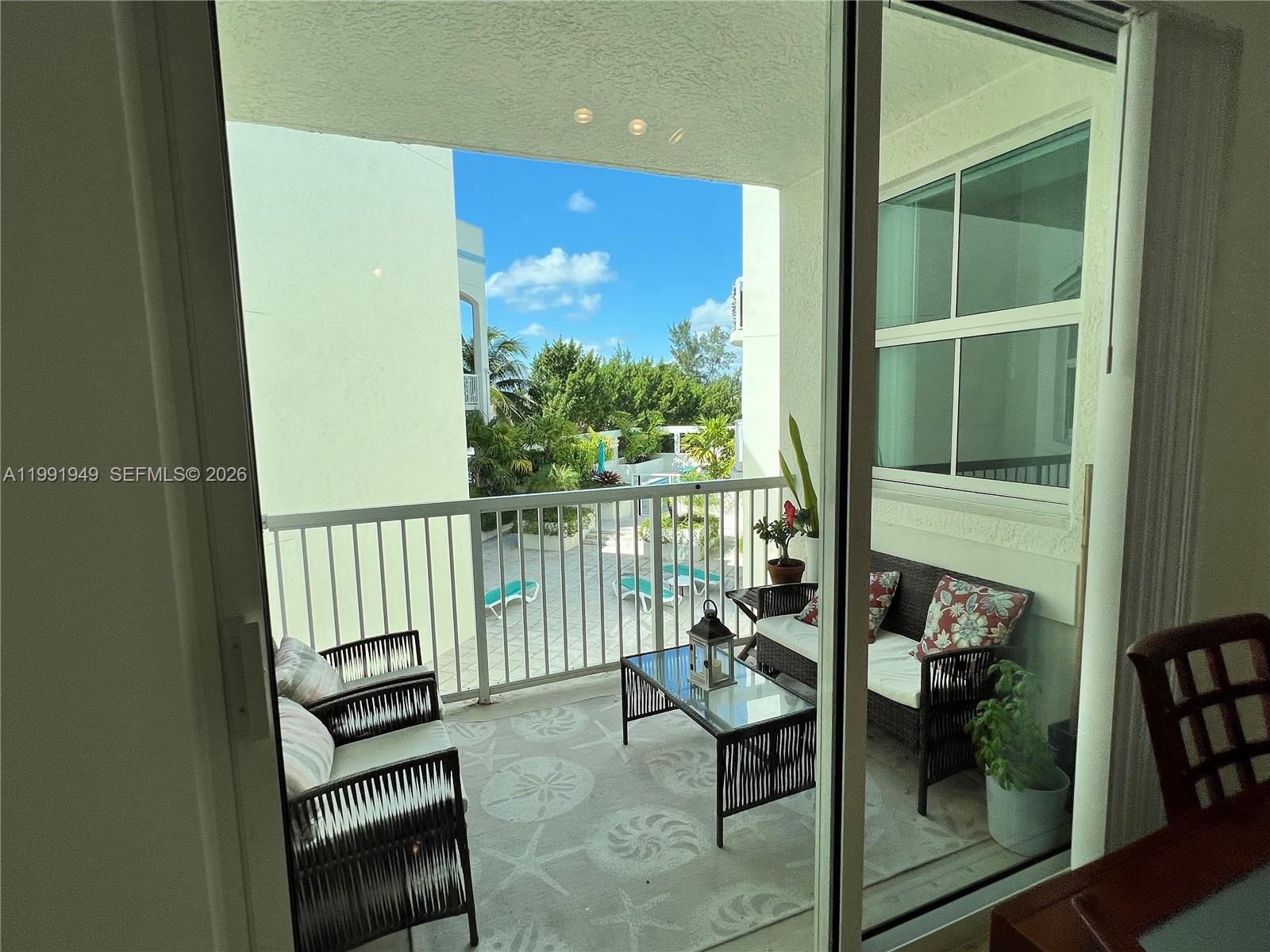 9172 Collins Avenue, Unit 305 Surfside, FL 33154 - Photo 15 of 37 a view of a balcony with chairs