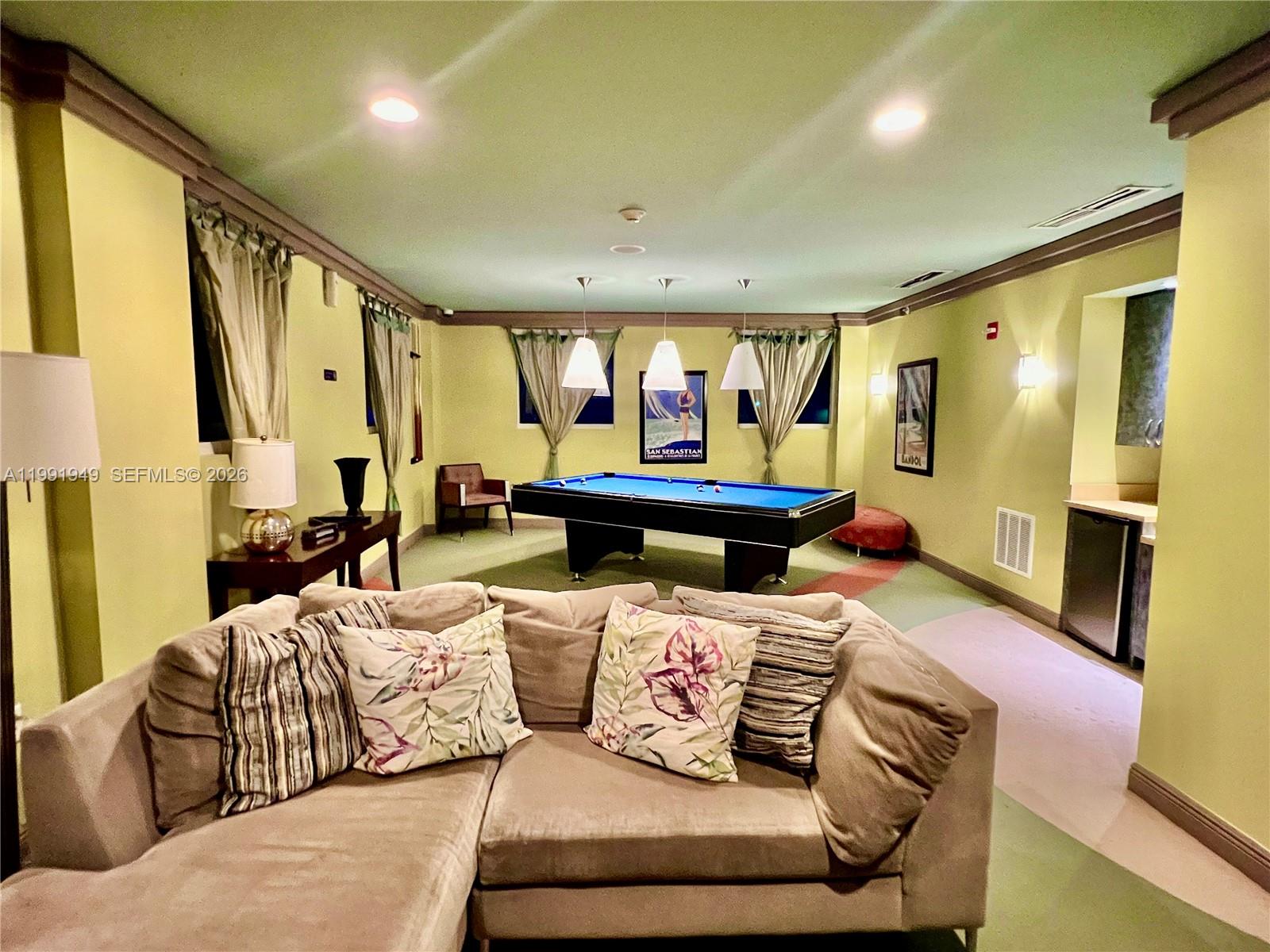 9172 Collins Avenue, Unit 305 Surfside, FL 33154 - Photo 25 of 37 a living room with furniture and a large window