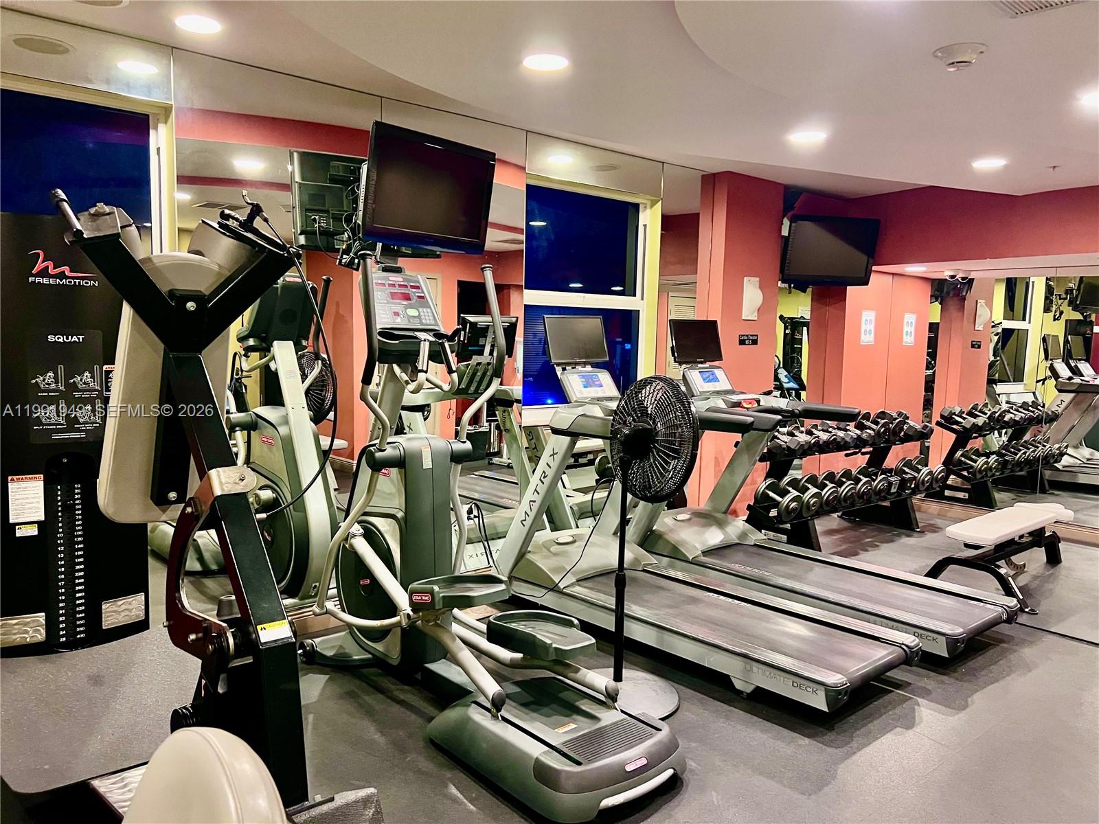 9172 Collins Avenue, Unit 305 Surfside, FL 33154 - Photo 26 of 37 a view of a room with gym equipment