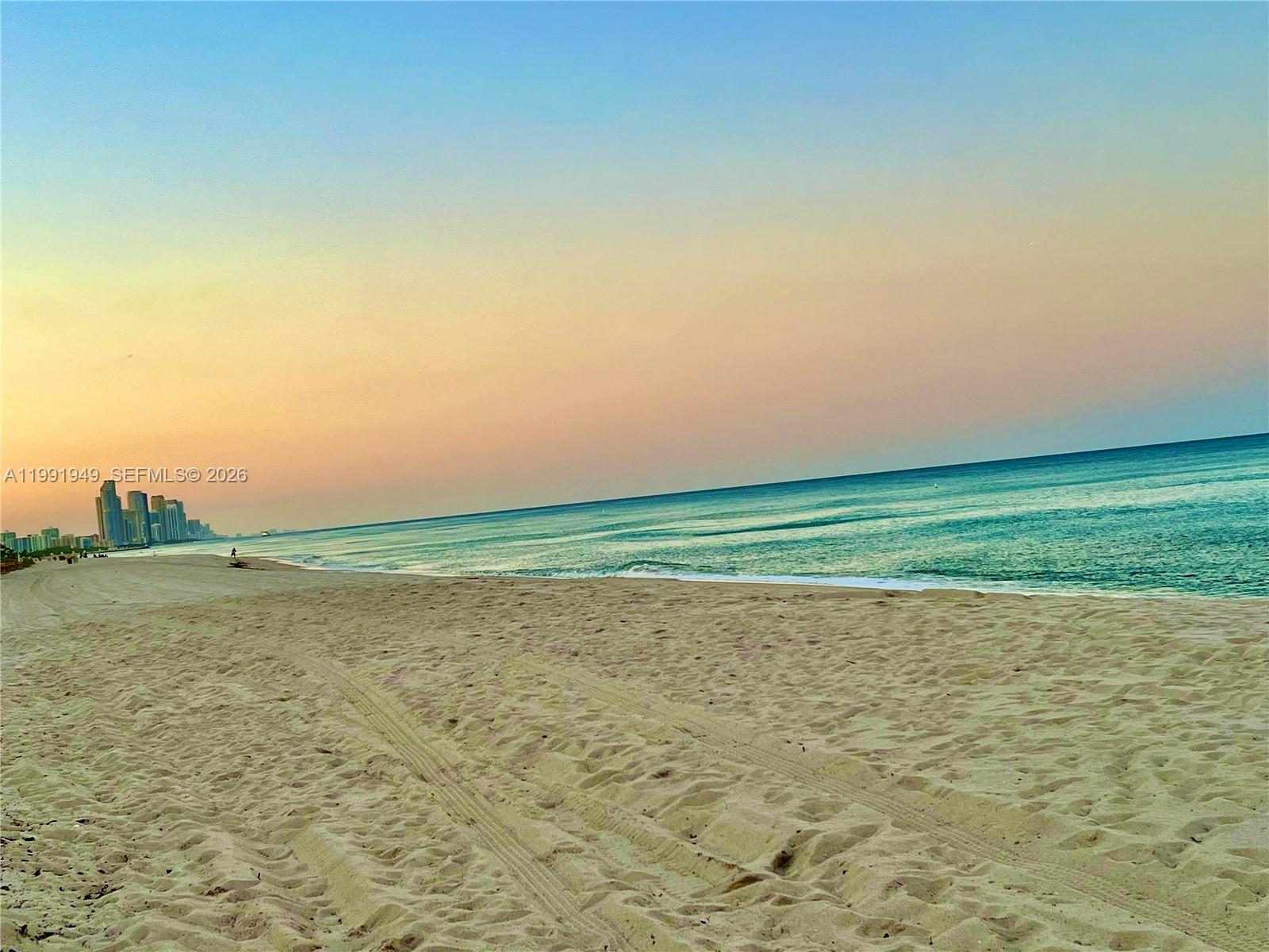 9172 Collins Avenue, Unit 305 Surfside, FL 33154 - Photo 31 of 37 a view of a ocean beach