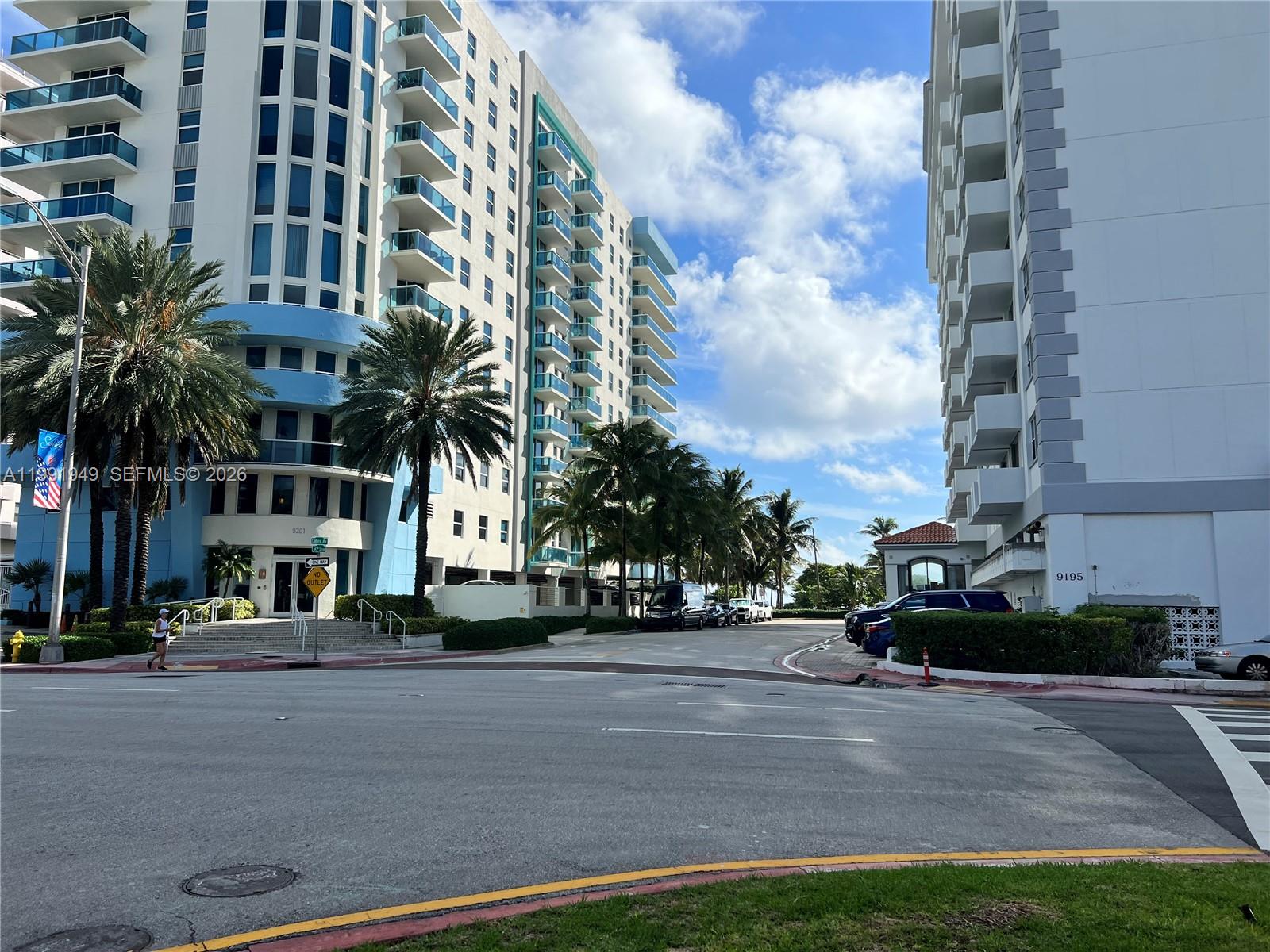 9172 Collins Avenue, Unit 305 Surfside, FL 33154 - Photo 37 of 37 a cars parked in front of a building