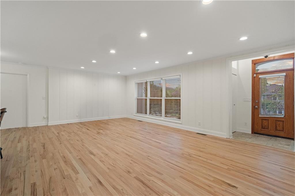 511 Boulevard Heights Calhoun, GA 30701 - Photo 11 of 69 a view of an empty room with wooden floor and windows