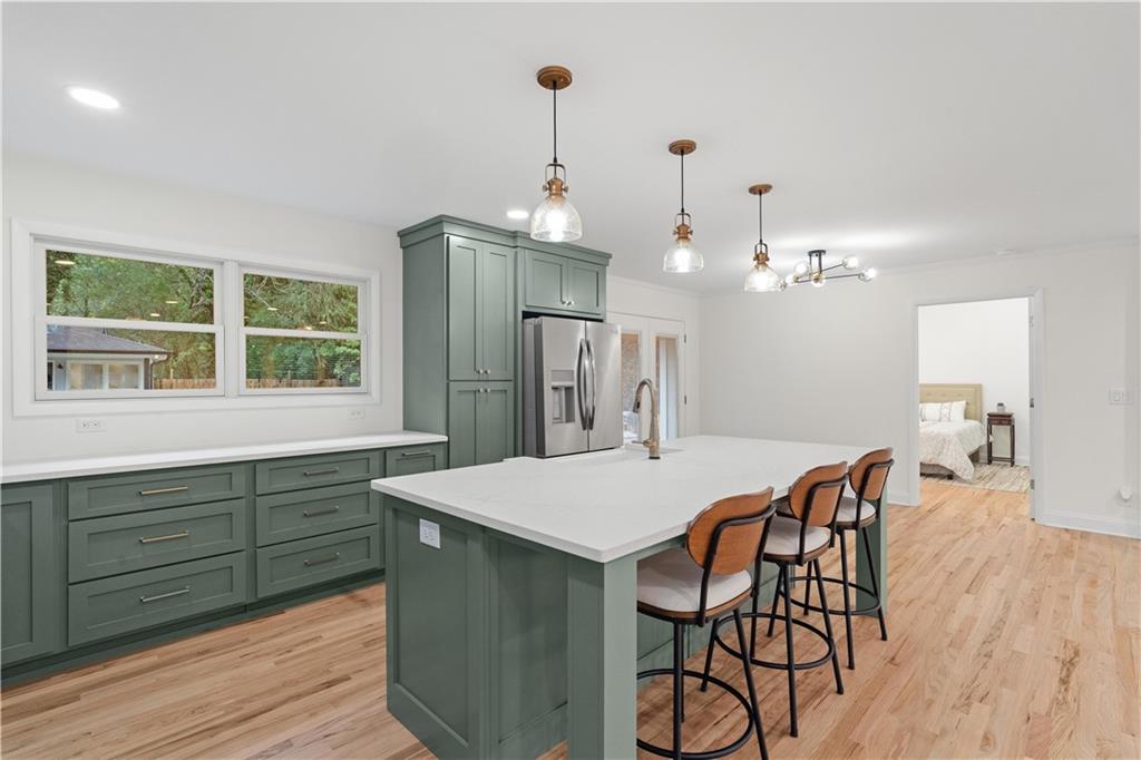 511 Boulevard Heights Calhoun, GA 30701 - Photo 14 of 69 a view of a dining room with furniture window and wooden floor