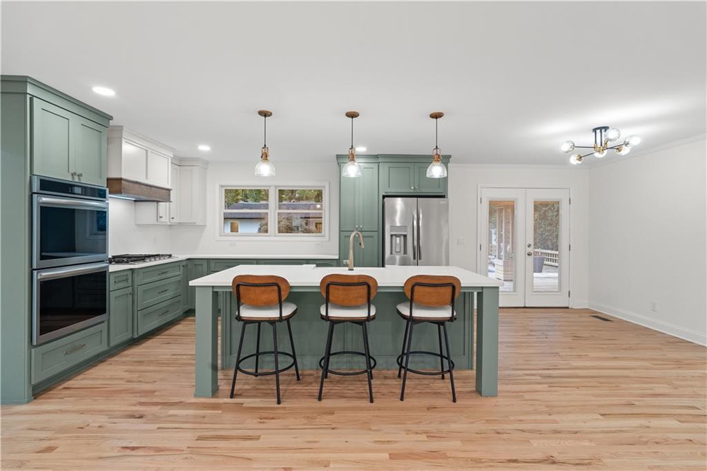 511 Boulevard Heights Calhoun, GA 30701 - Photo 16 of 69 a view of a dining room with furniture and wooden floor