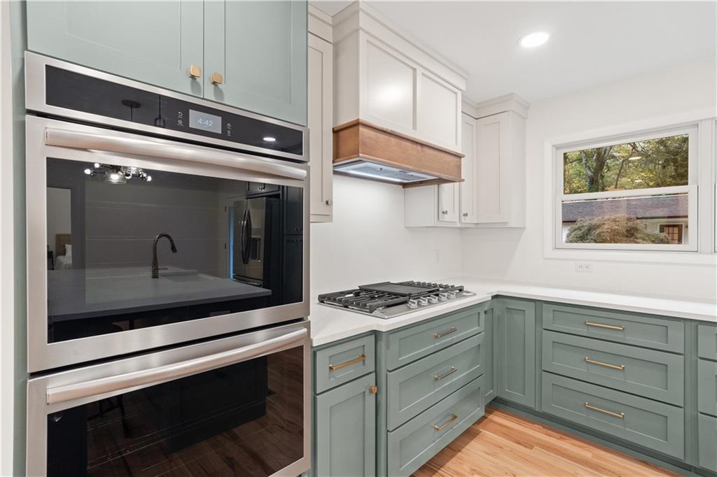 511 Boulevard Heights Calhoun, GA 30701 - Photo 19 of 69 a kitchen with stainless steel appliances granite countertop a stove and a microwave