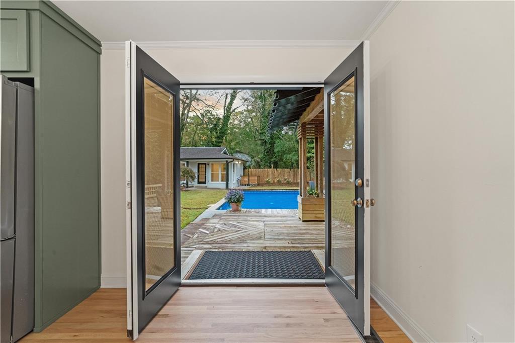 511 Boulevard Heights Calhoun, GA 30701 - Photo 21 of 69 a view of hallway with a floor to ceiling window and wooden floor