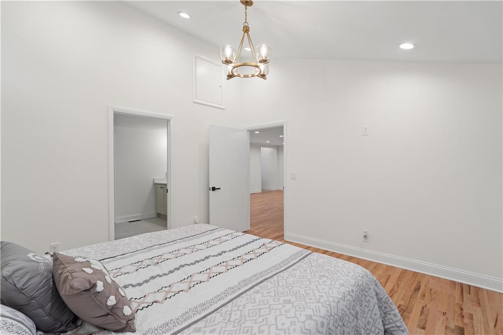 511 Boulevard Heights Calhoun, GA 30701 - Photo 23 of 69 a bedroom with a bed and a chandelier