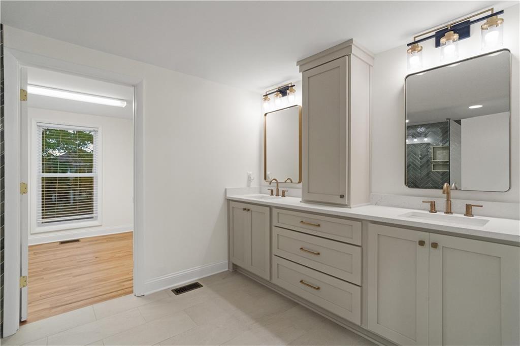 511 Boulevard Heights Calhoun, GA 30701 - Photo 25 of 69 a bathroom with a double vanity sink and a mirror