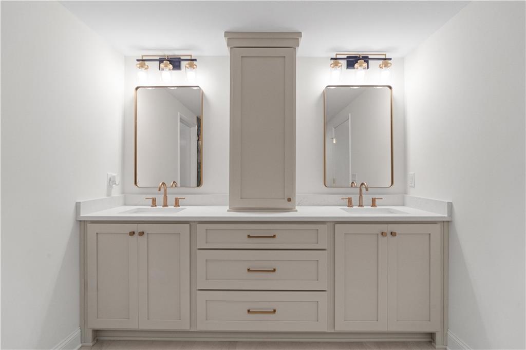 511 Boulevard Heights Calhoun, GA 30701 - Photo 26 of 69 a bathroom with double vanity sinks and a mirror