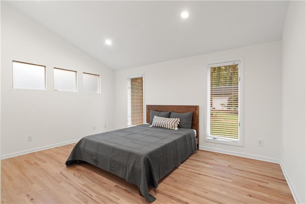 511 Boulevard Heights Calhoun, GA 30701 - Photo 30 of 69 a bedroom with a bed and wooden floor