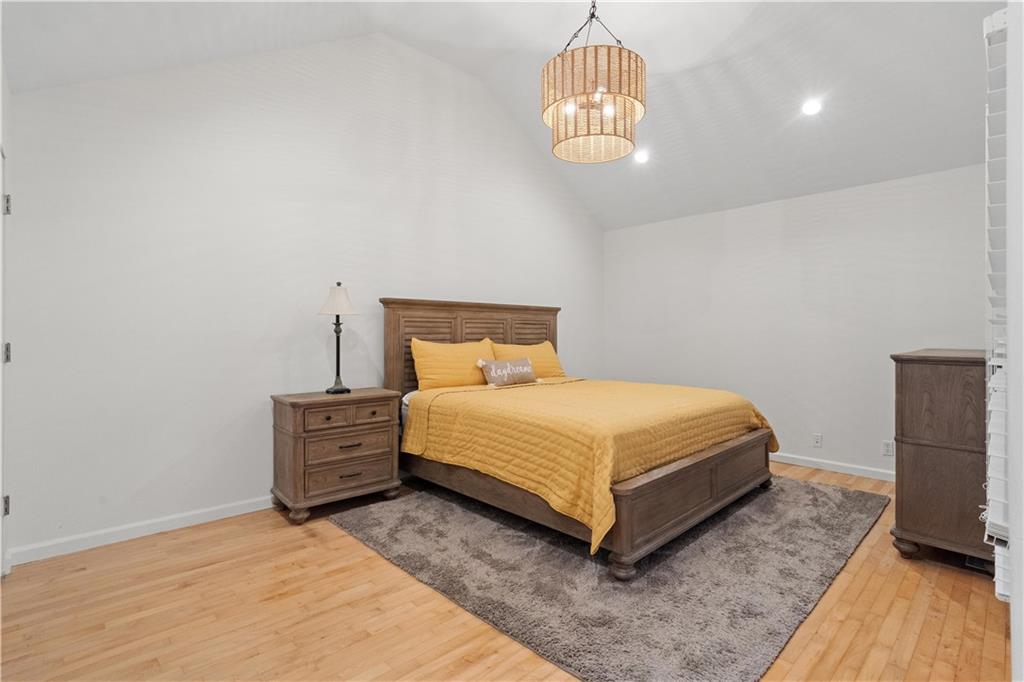 511 Boulevard Heights Calhoun, GA 30701 - Photo 33 of 69 a bedroom with a bed and a chandelier