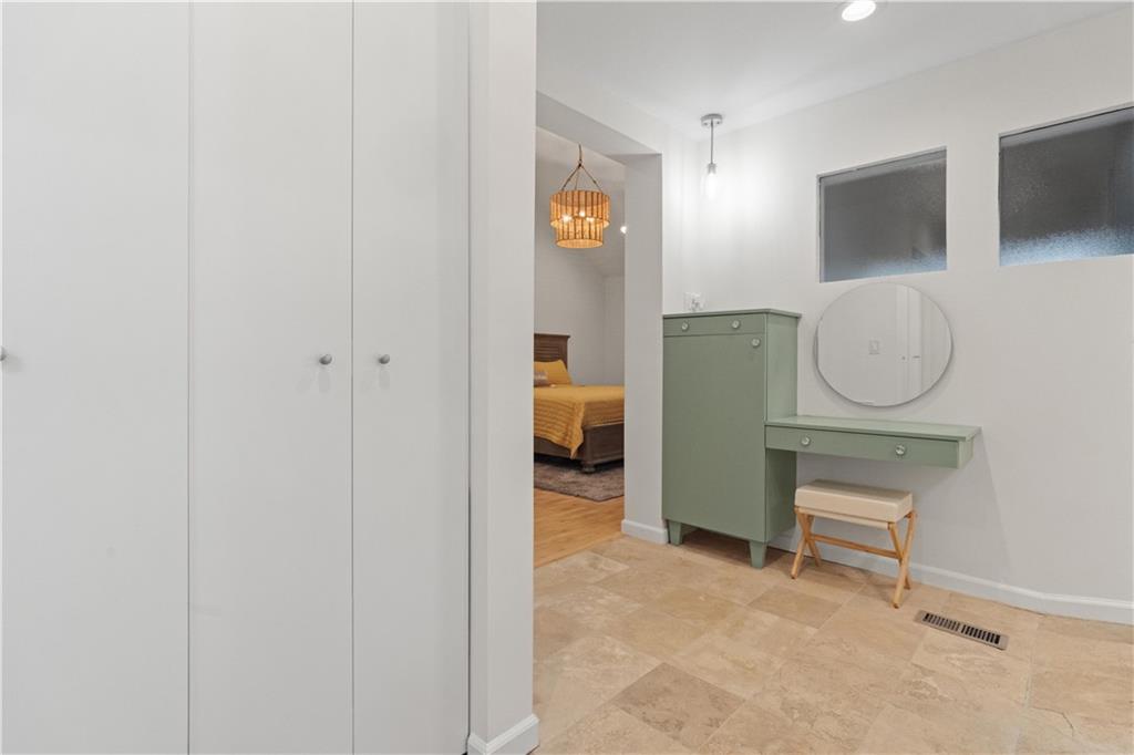 511 Boulevard Heights Calhoun, GA 30701 - Photo 38 of 69 a room that has a chair and a mirror in it