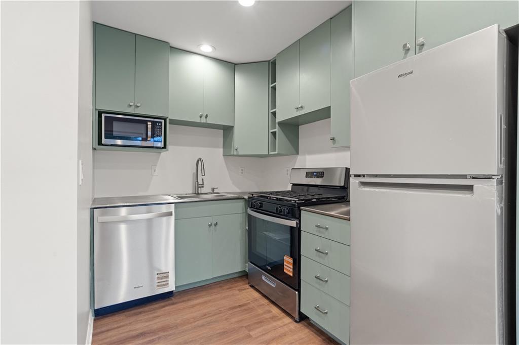 511 Boulevard Heights Calhoun, GA 30701 - Photo 43 of 69 a kitchen with stainless steel appliances granite countertop a refrigerator stove a sink and dishwasher