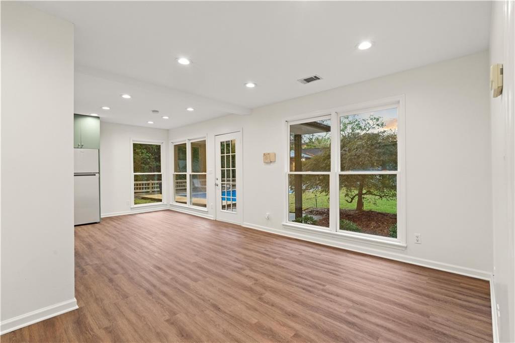 511 Boulevard Heights Calhoun, GA 30701 - Photo 45 of 69 a view of an empty room with wooden floor and windows