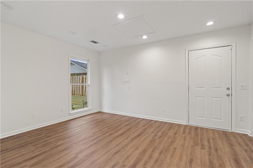 511 Boulevard Heights Calhoun, GA 30701 - Photo 46 of 69 wooden floor in an empty room with a window