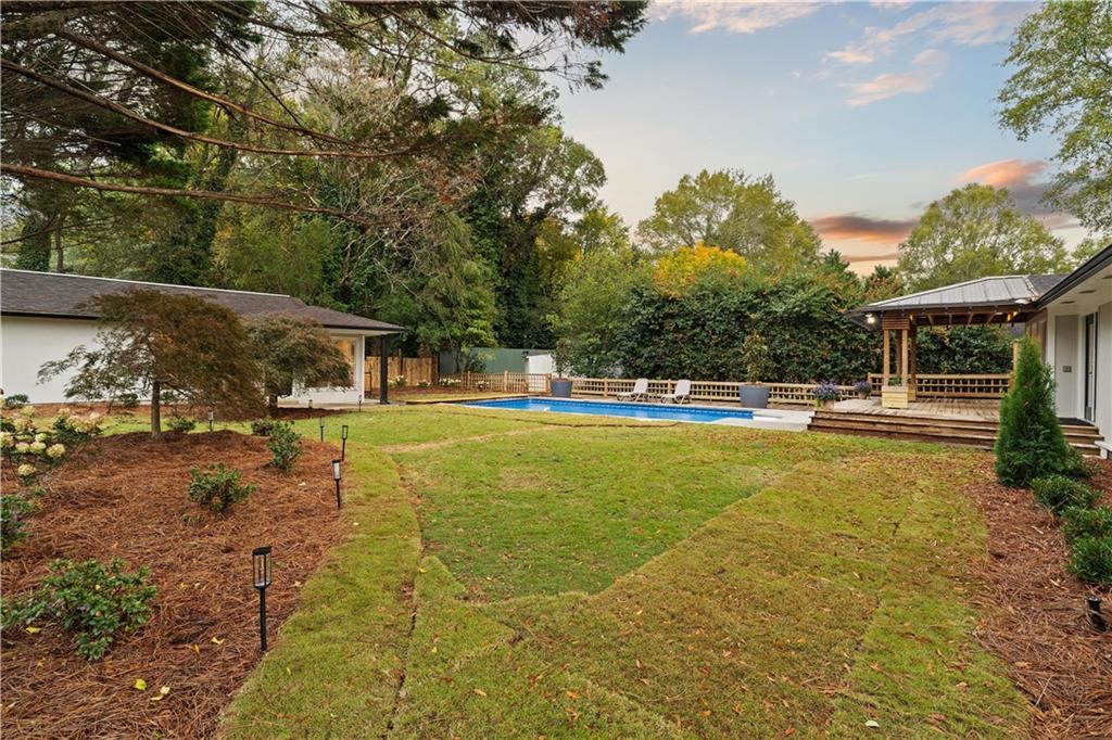 511 Boulevard Heights Calhoun, GA 30701 - Photo 51 of 69 a swimming pool with outdoor seating and yard