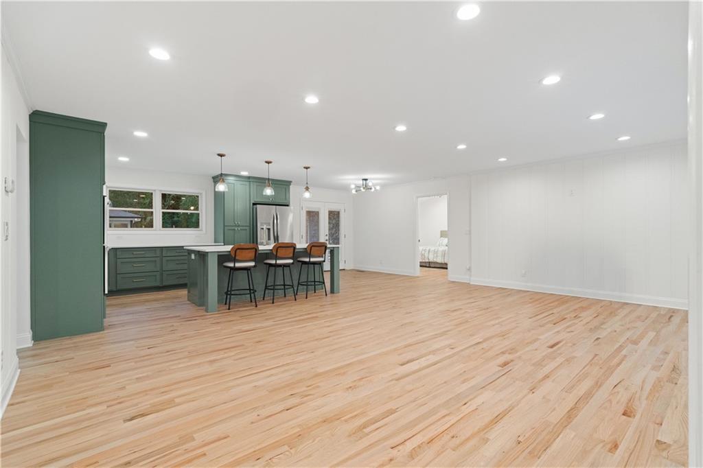 511 Boulevard Heights Calhoun, GA 30701 - Photo 10 of 69 a view of a kitchen with a dining table chairs and natural light