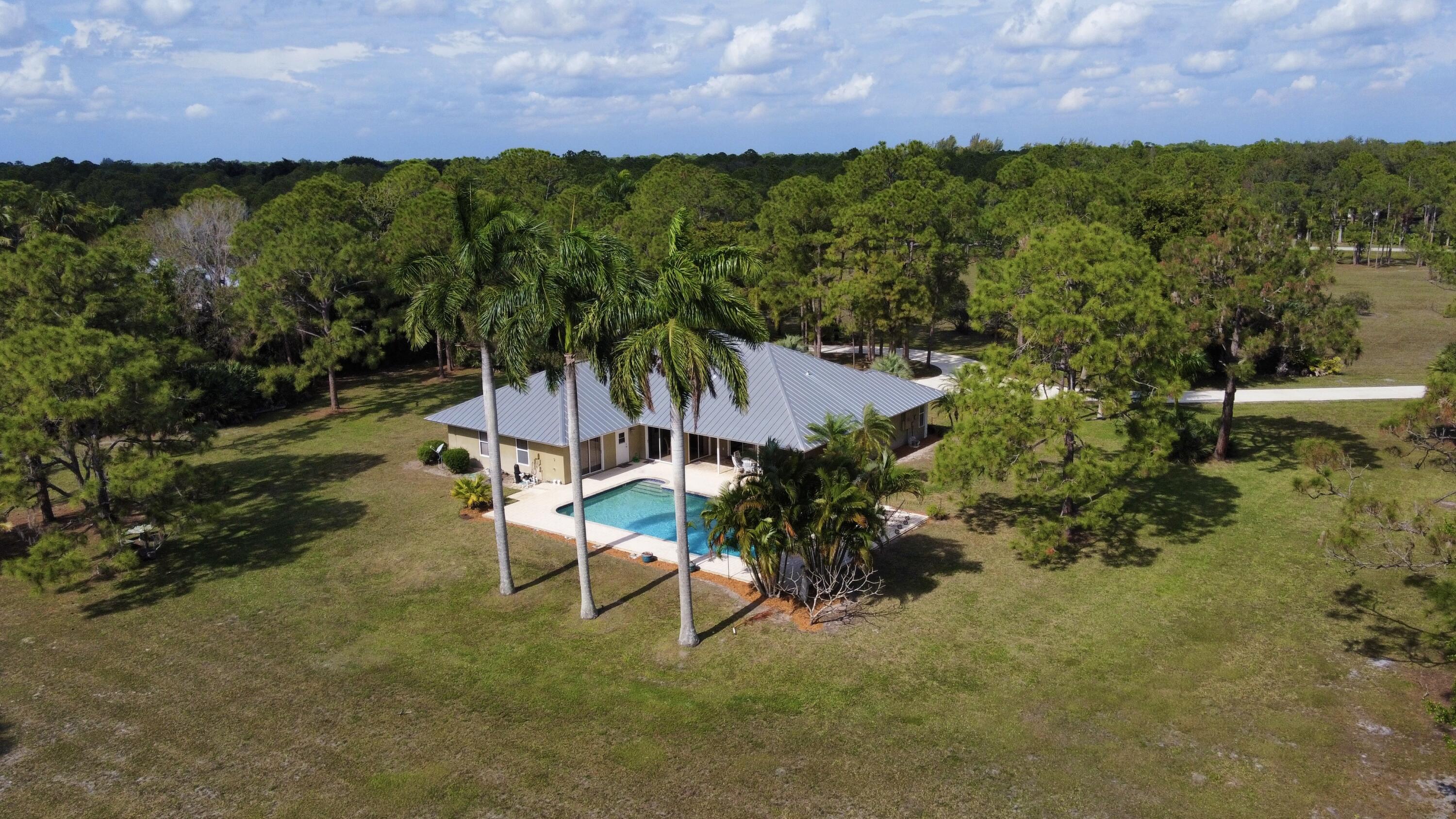 2884 Southeast Ranch Acres Circle Jupiter, FL 33478 - Photo 3 of 93 aerial back