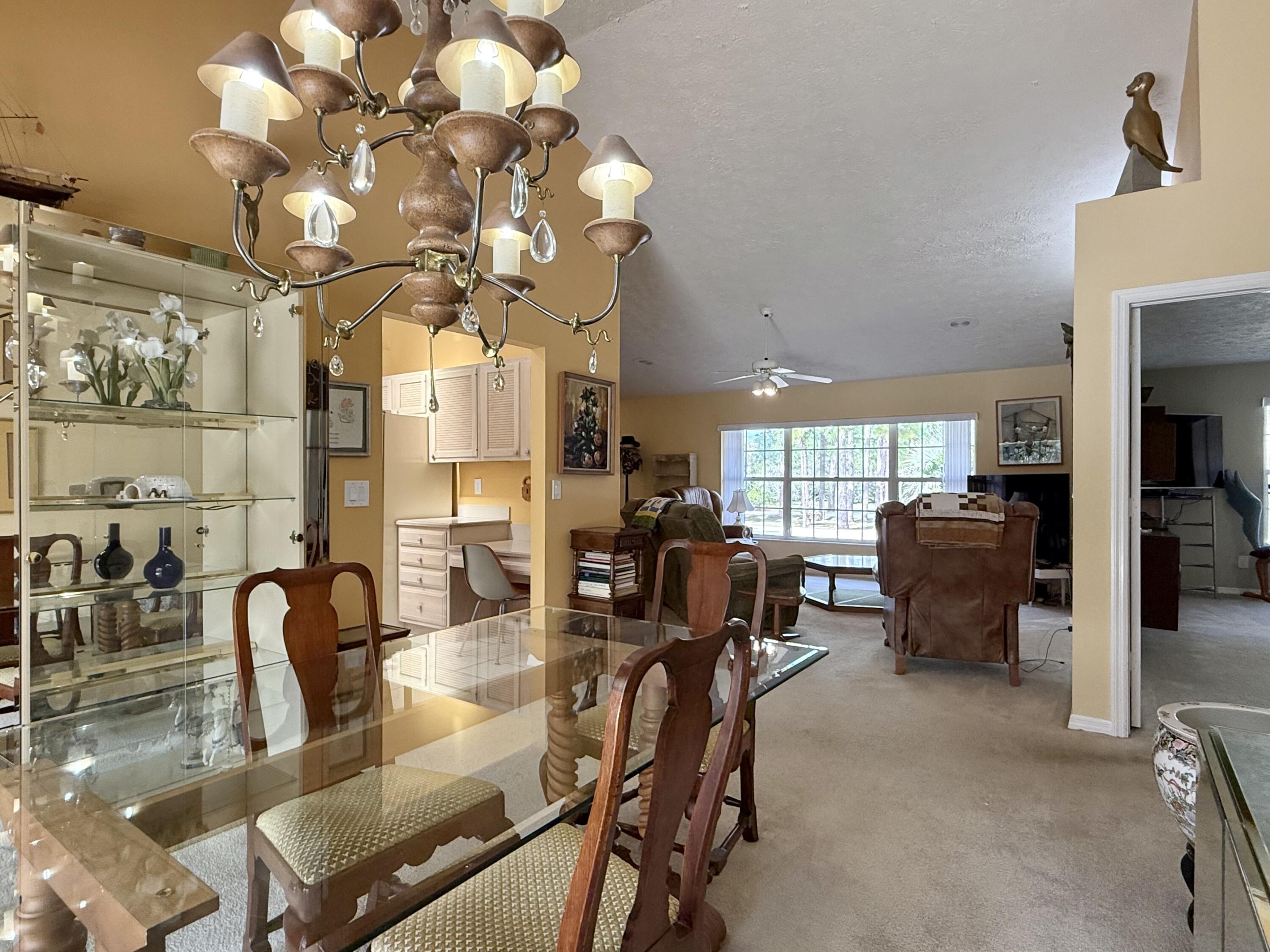 2884 Southeast Ranch Acres Circle Jupiter, FL 33478 - Photo 36 of 93 dining room to living room