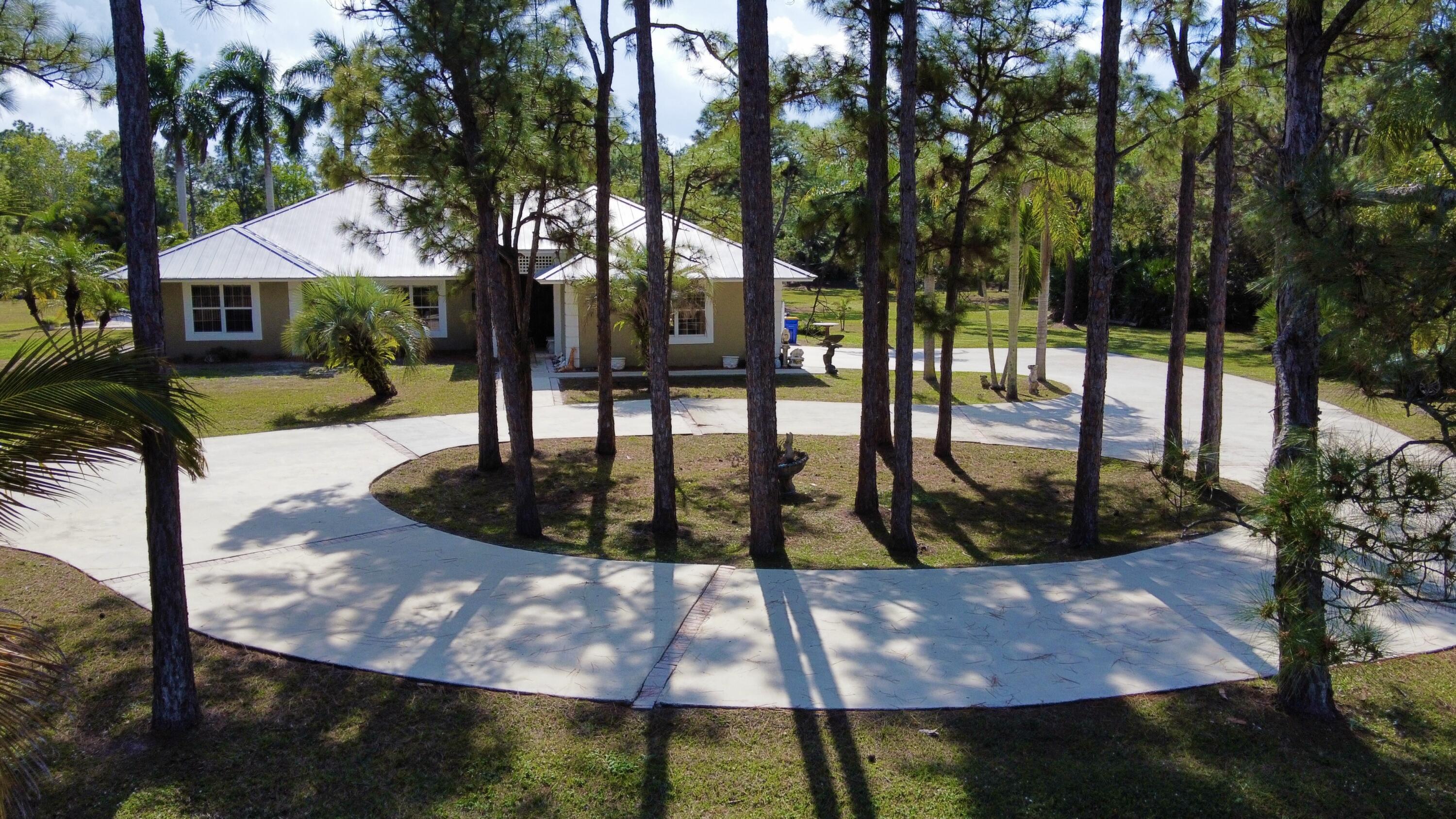 2884 Southeast Ranch Acres Circle Jupiter, FL 33478 - Photo 4 of 93 circular driveway aerial