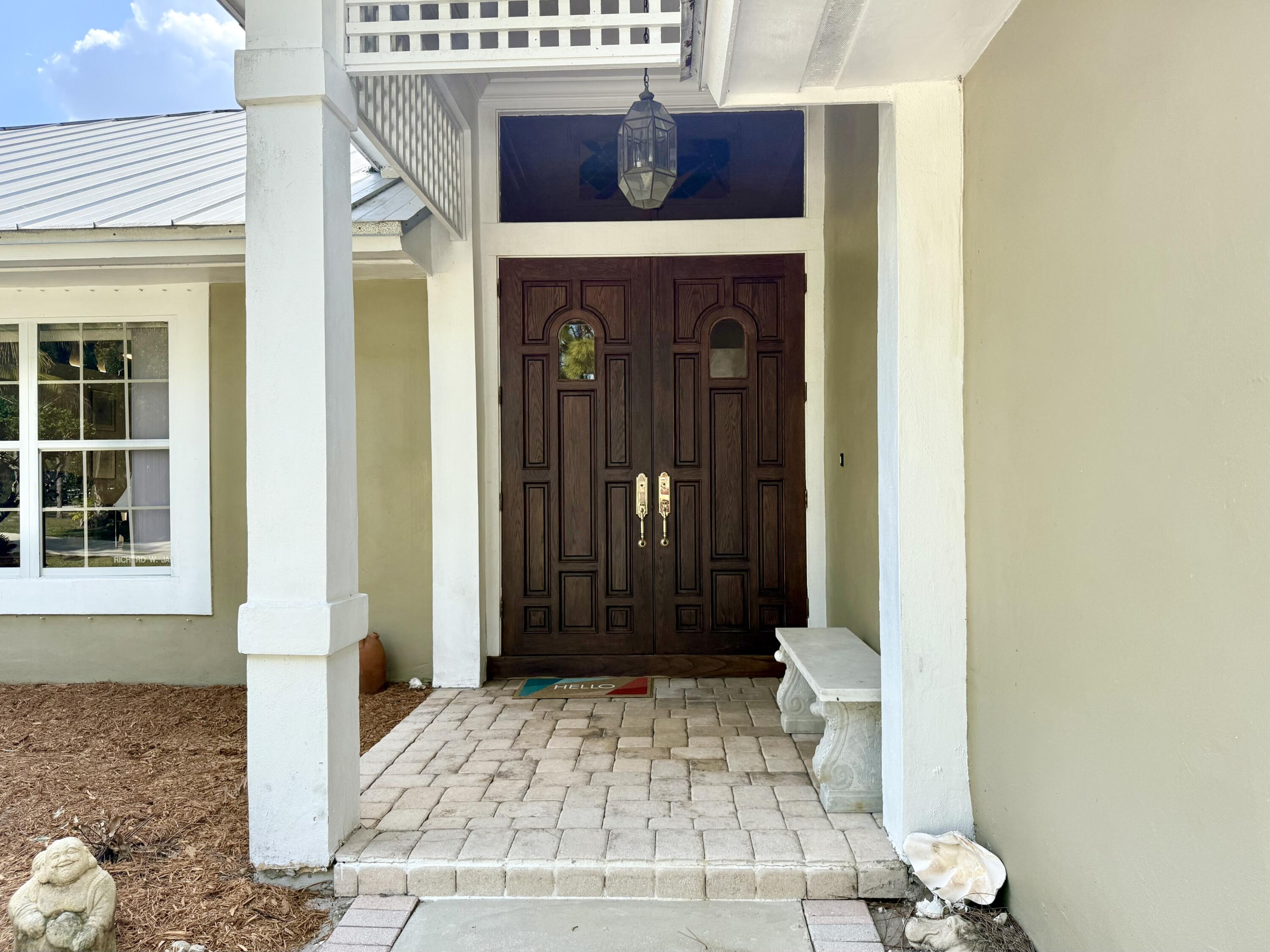 2884 Southeast Ranch Acres Circle Jupiter, FL 33478 - Photo 6 of 93 front door