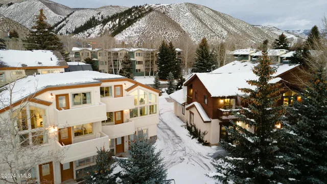 a aerial view of a house with a yard