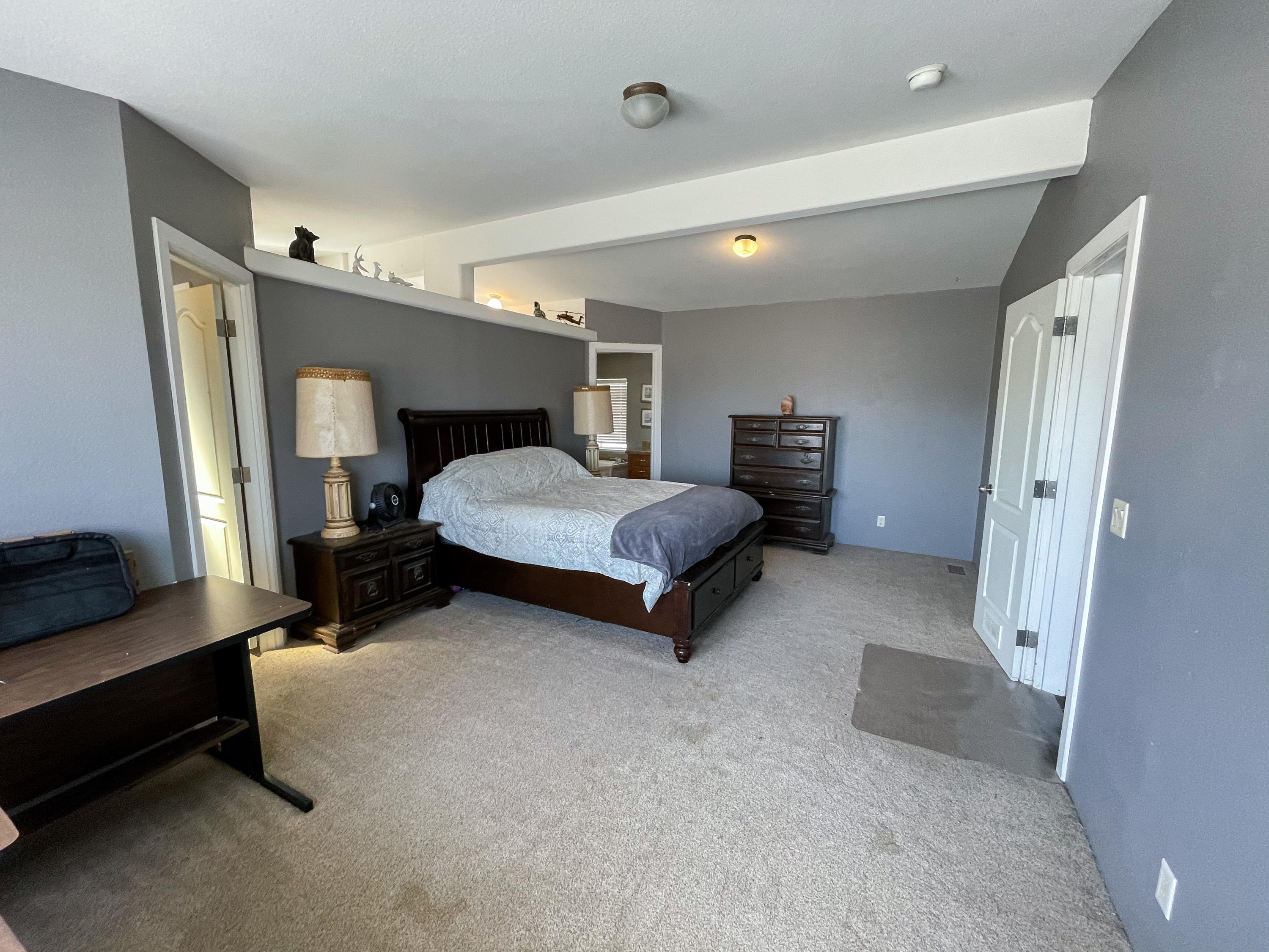 4647 Montiverde Road Mojave, CA 93501 - Photo 11 of 30 a bedroom with a bed and a dresser
