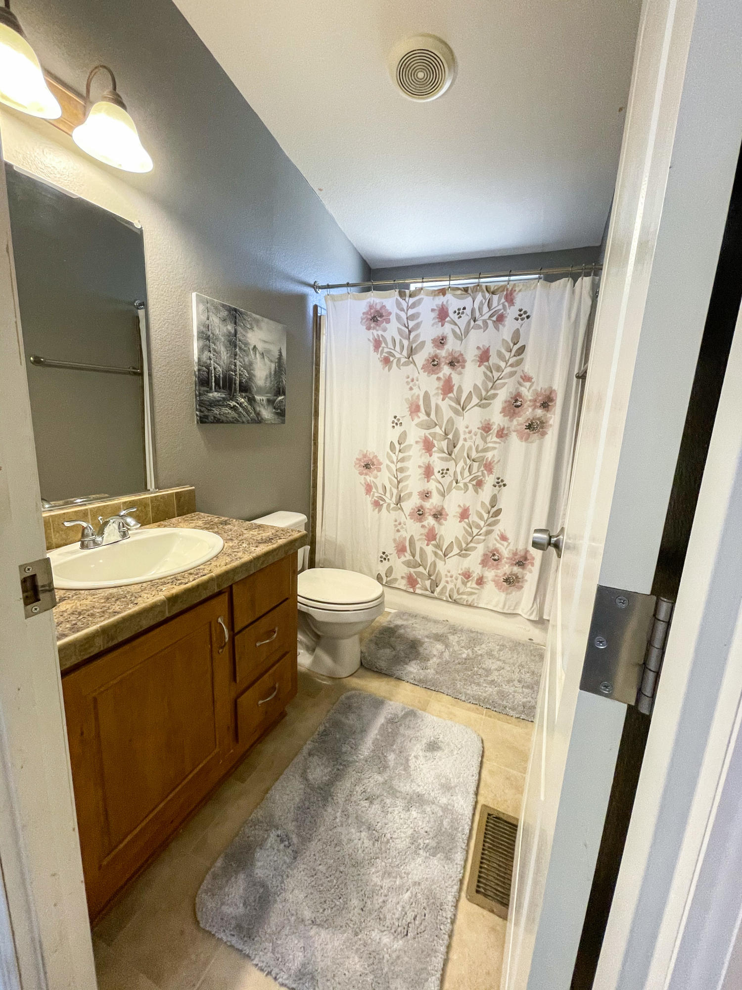 4647 Montiverde Road Mojave, CA 93501 - Photo 21 of 30 a bathroom with a granite countertop sink toilet and shower