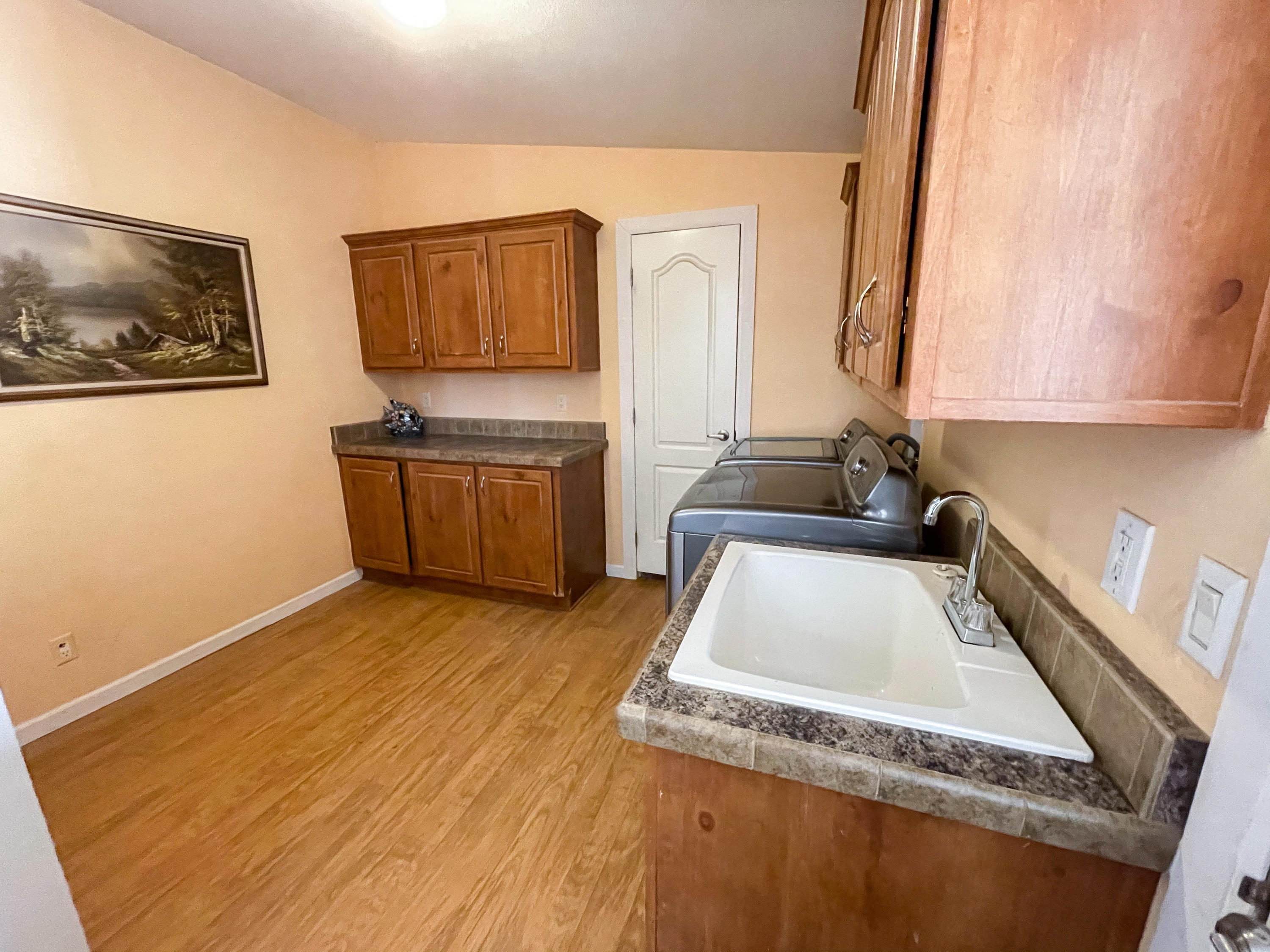 4647 Montiverde Road Mojave, CA 93501 - Photo 23 of 30 a kitchen with granite countertop a stove and a sink