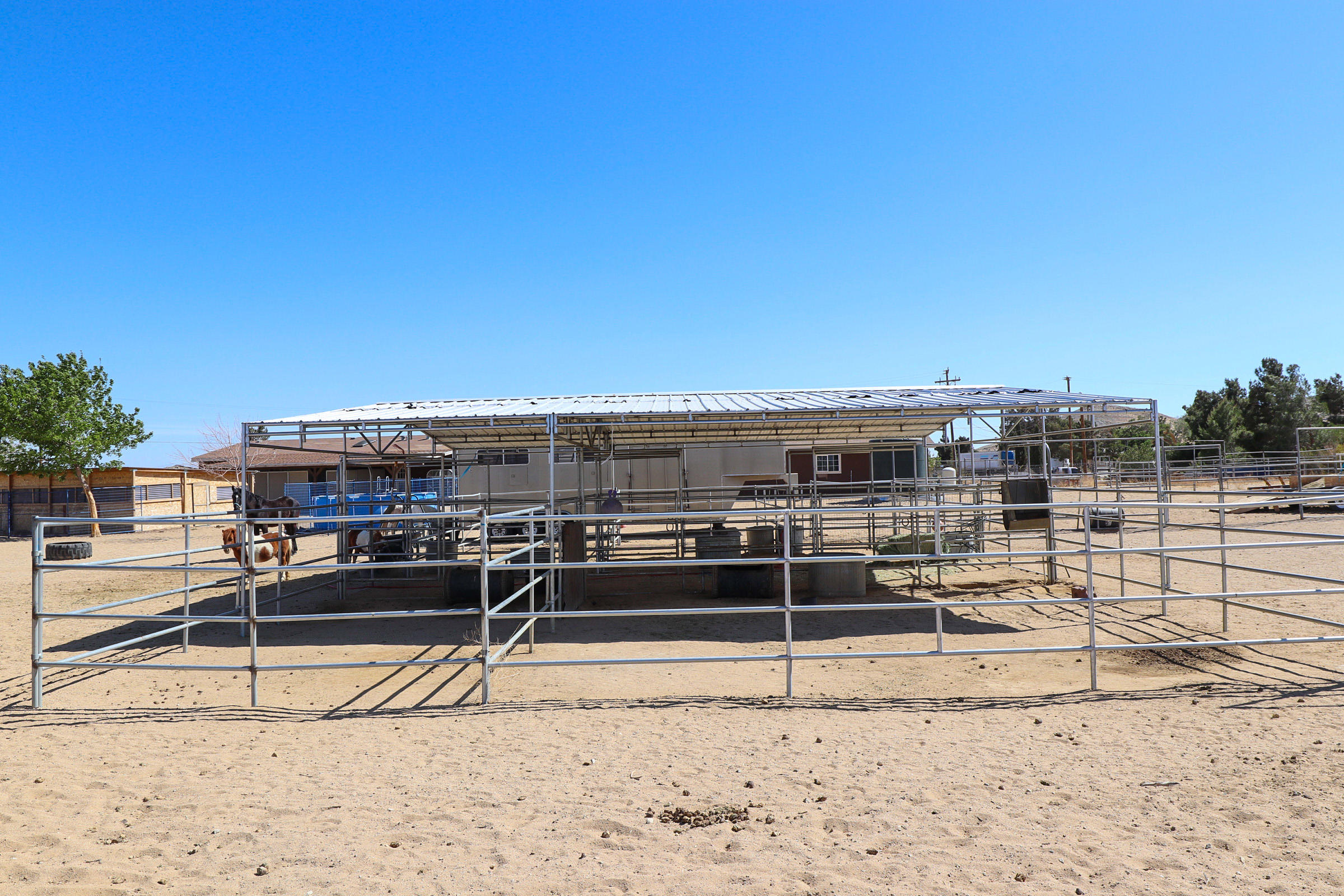 4647 Montiverde Road Mojave, CA 93501 - Photo 29 of 30 a view of a roof deck with two chair and a potted plant