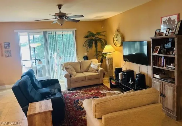 a living room with furniture workspace and a window