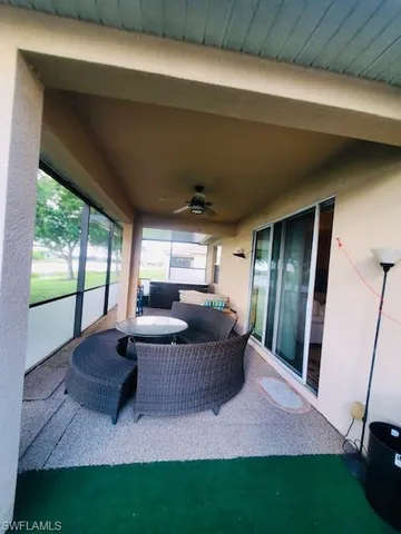 a living room with furniture and a yard