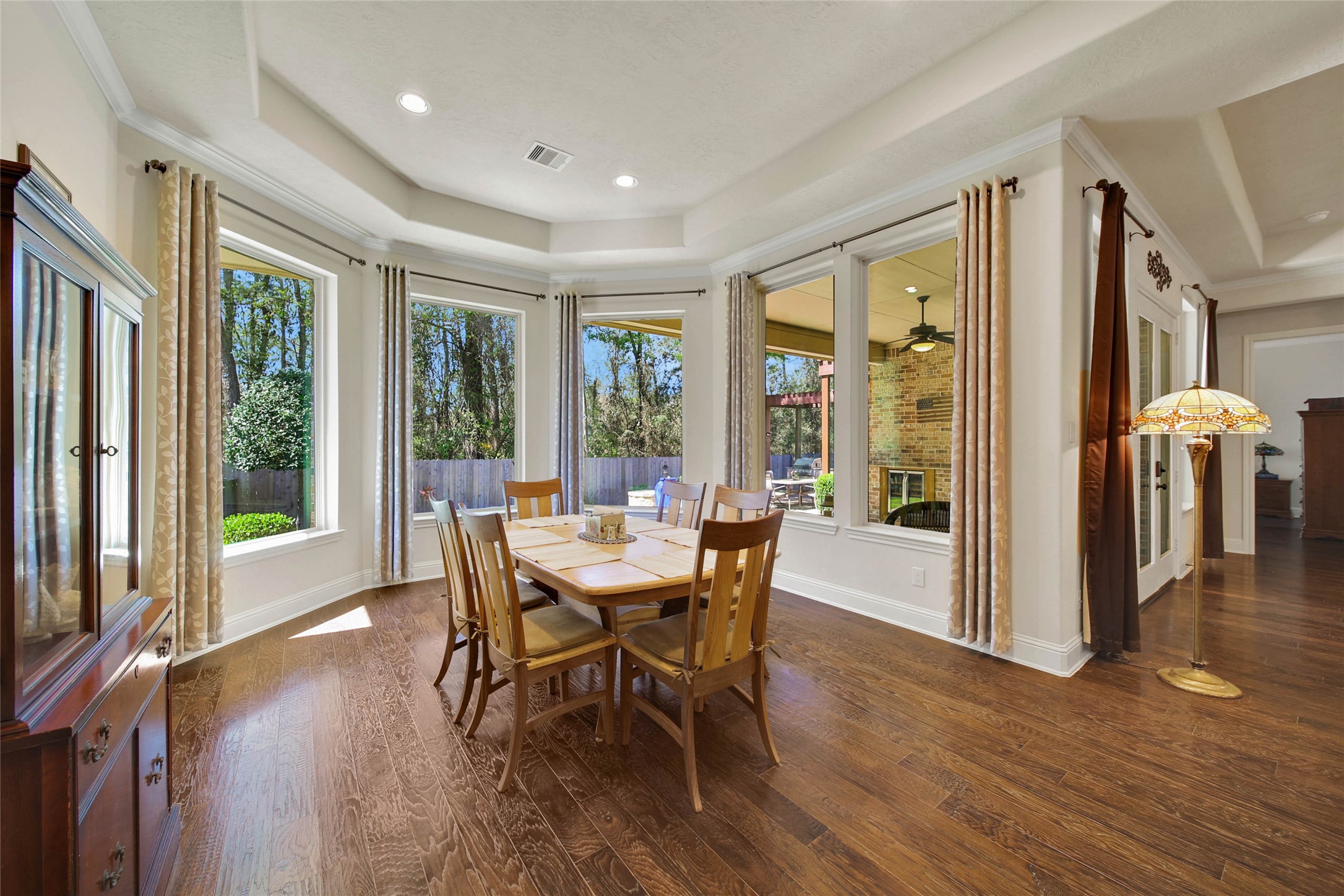 3234 Explorer Way Conroe, TX 77301 - Photo 26 of 46 Sip your coffee and watch birds from your breakfast room. This space could also be used as a formal dining, plenty of room for a larger table and furniture.