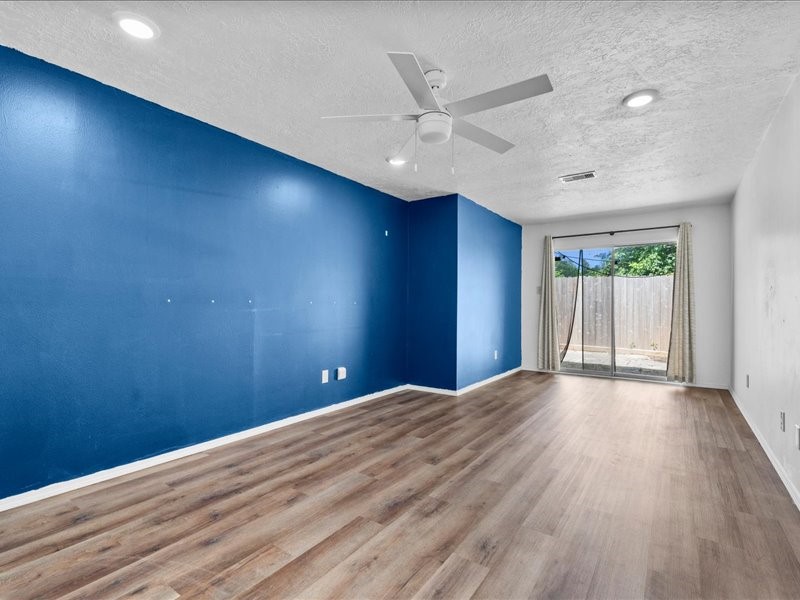 6631 Ambler Drive Spring, TX 77379 - Photo 22 of 37 wooden floor in an empty room with a window