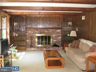 106 North Chapman Road Doylestown, PA 18901 - Photo 4 of 9 a living room with furniture and a fireplace