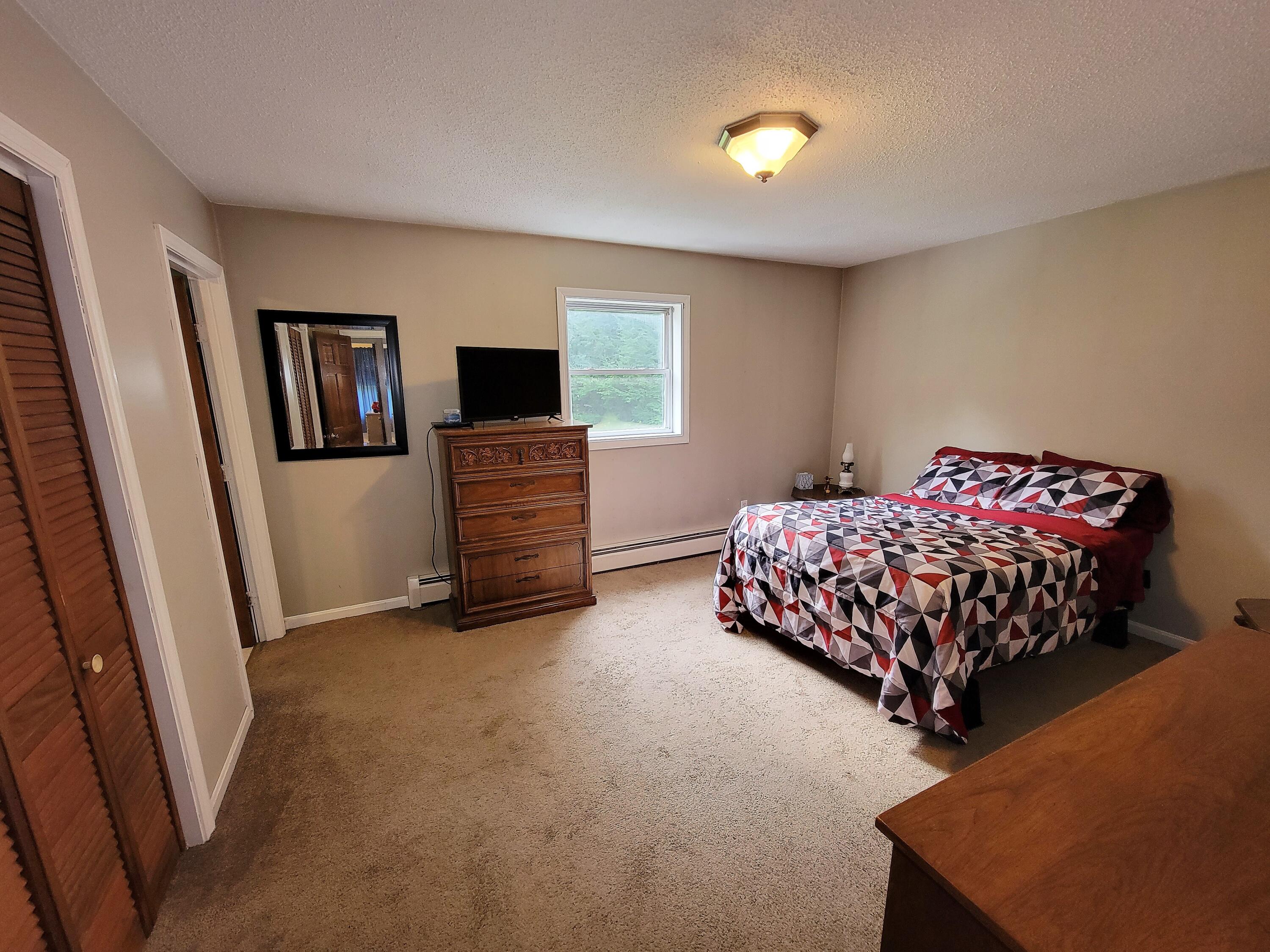 125 Wesley Road Unity, ME 04988 - Photo 8 of 18 Master Bedroom