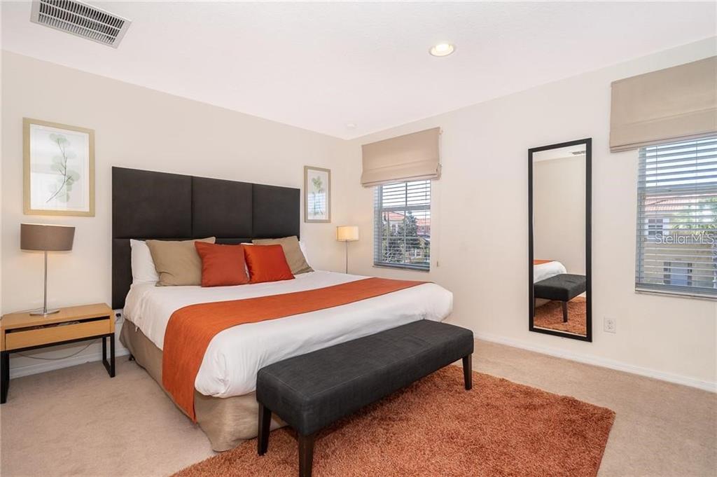 3007 White Orchid Road Kissimmee, FL 34747 - Photo 13 of 23 a bedroom with a bed and window