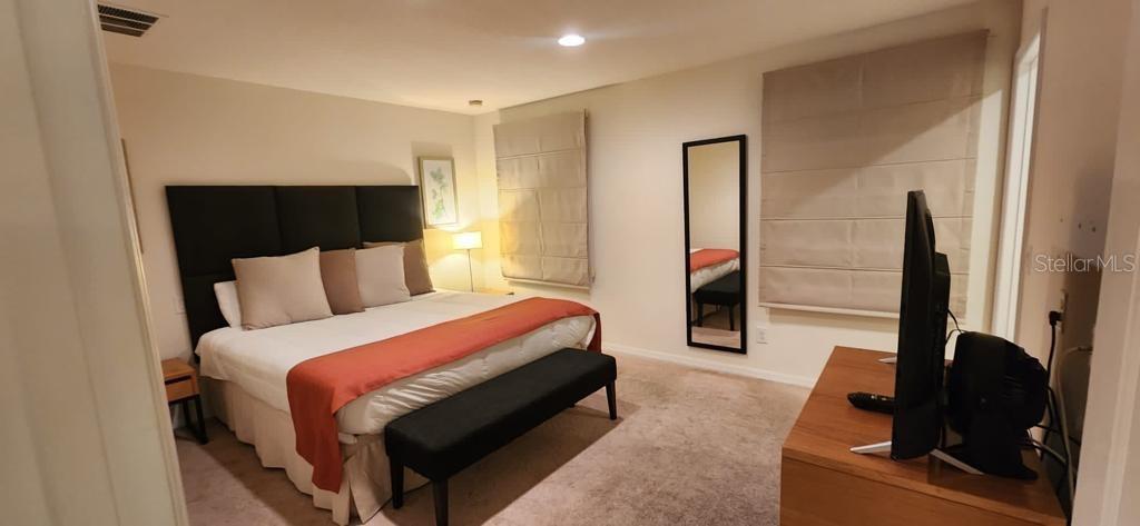 3007 White Orchid Road Kissimmee, FL 34747 - Photo 14 of 23 a bed room with a bed and a window