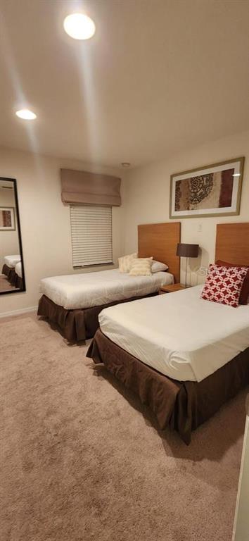 3007 White Orchid Road Kissimmee, FL 34747 - Photo 17 of 23 a bedroom with two beds and painting on the wall