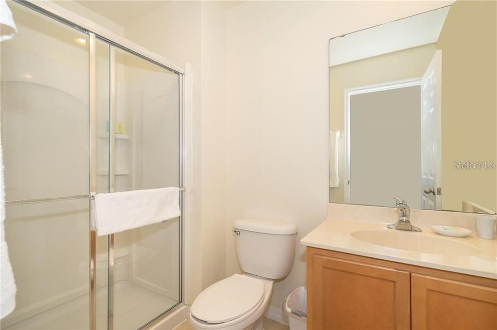 3007 White Orchid Road Kissimmee, FL 34747 - Photo 18 of 23 a bathroom with a sink a toilet and shower