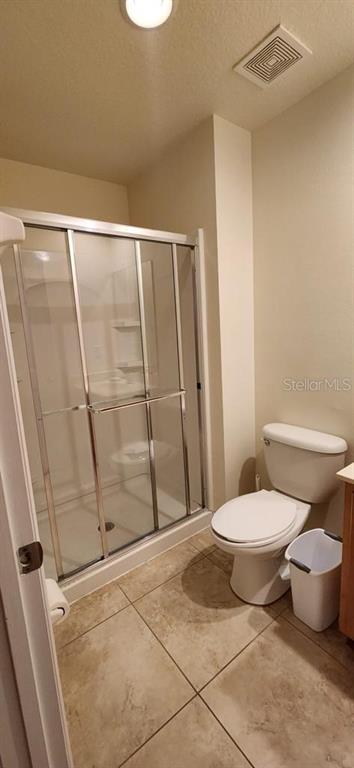 3007 White Orchid Road Kissimmee, FL 34747 - Photo 19 of 23 a bathroom with a toilet and a shower