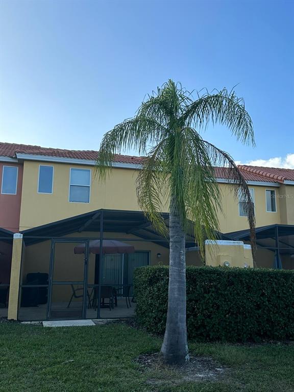 3007 White Orchid Road Kissimmee, FL 34747 - Photo 23 of 23 a view of a house with a yard and plants
