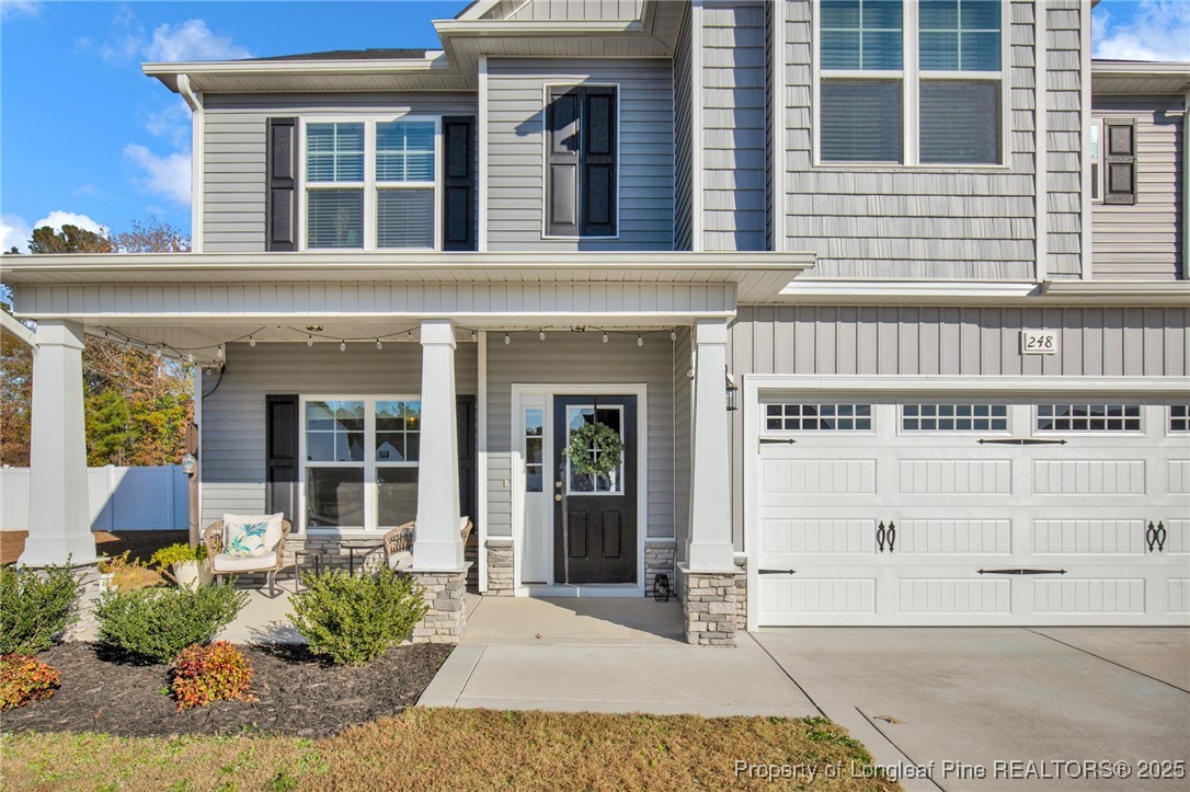 248 Rainy Beck Way Erwin, NC 28339 - Photo 3 of 44 a view of a brick building with large windows