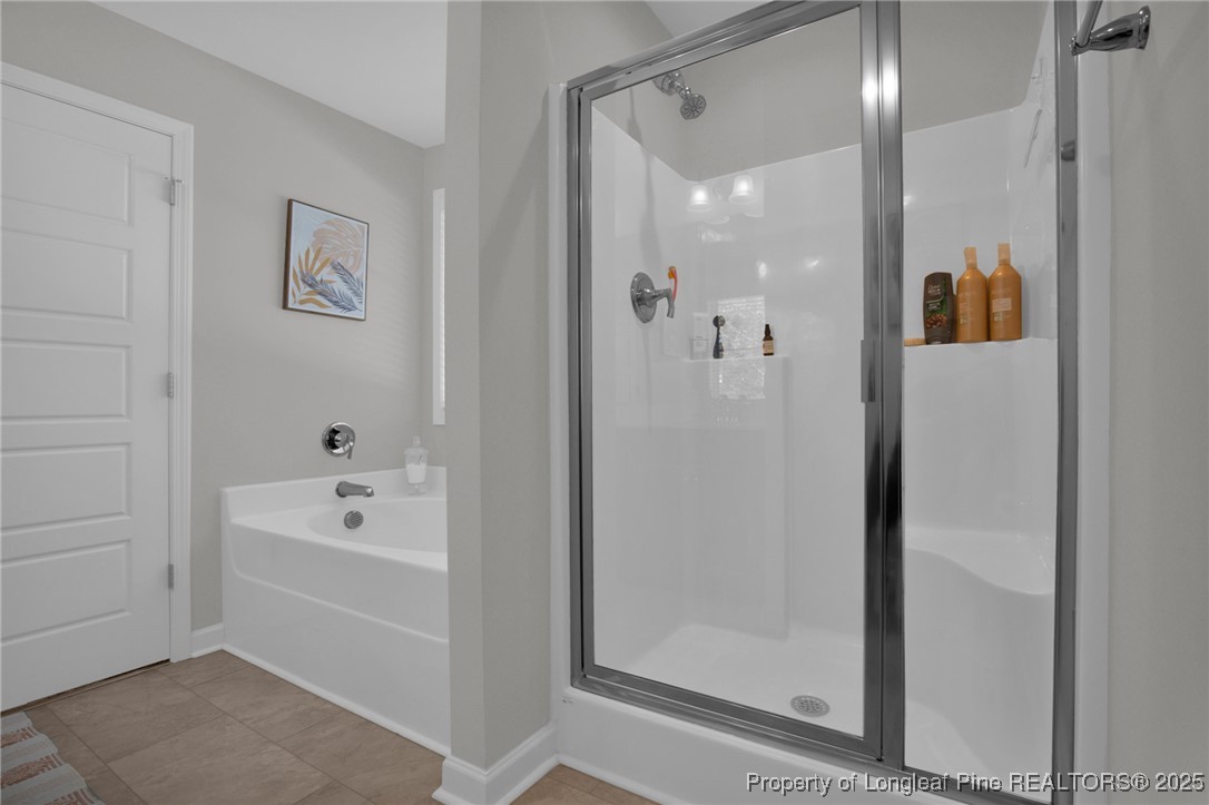 248 Rainy Beck Way Erwin, NC 28339 - Photo 34 of 44 a bathroom with a bathtub and a shower